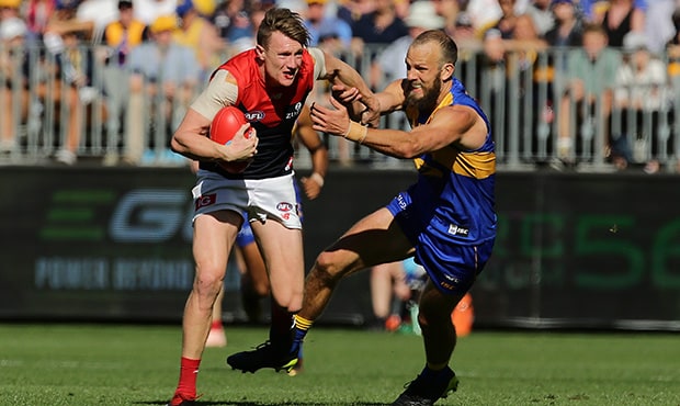 AFL 2018 Second Preliminary Final - West Coast v Melbourne PERTH, AUSTRALIA - SEPTEMBER 22: Aaron vandenBerg of the Demons fends off Will Schofield of the Eagles during the 2018 AFL Second Preliminary Final match between the West Coast Eagles and the Melbourne Demons at Optus Stadium on September 22, 2018 in Perth, Australia. (Photo by Will Russell/AFL Media)